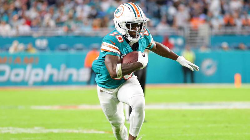 MIAMI GARDENS, FLORIDA - DECEMBER 24: Tyreek Hill #10 of the Miami Dolphins runs for yards during a game against the Dallas Cowboys at Hard Rock Stadium on December 24, 2023 in Miami Gardens, Florida.  The Dolphins defeated the Cowboys 22-20. (Photo by Stacy Revere/Getty Images)